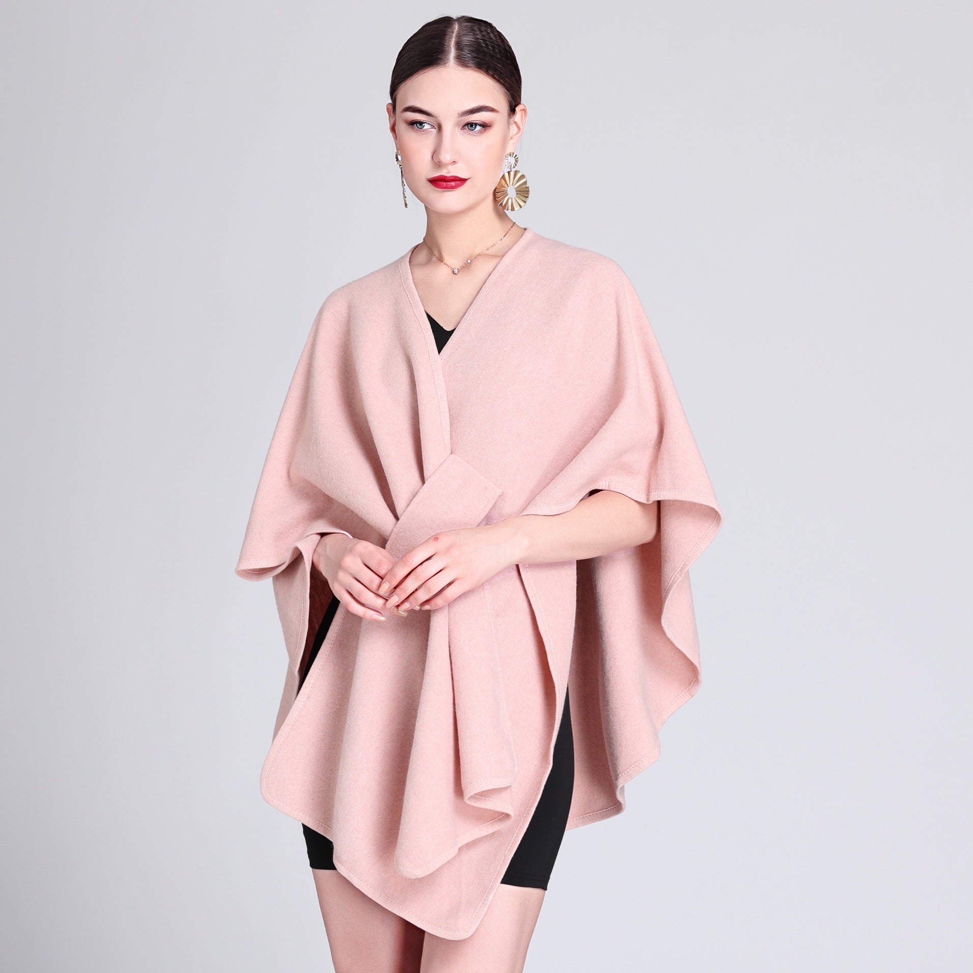 Marina caped fleece shawl draped over the shoulders in a soft neutral tone