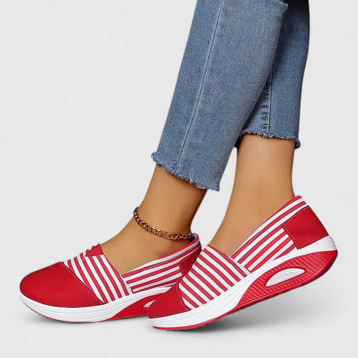 Comfortable everyday women's slip-on sneakers shown in blue, black and red
