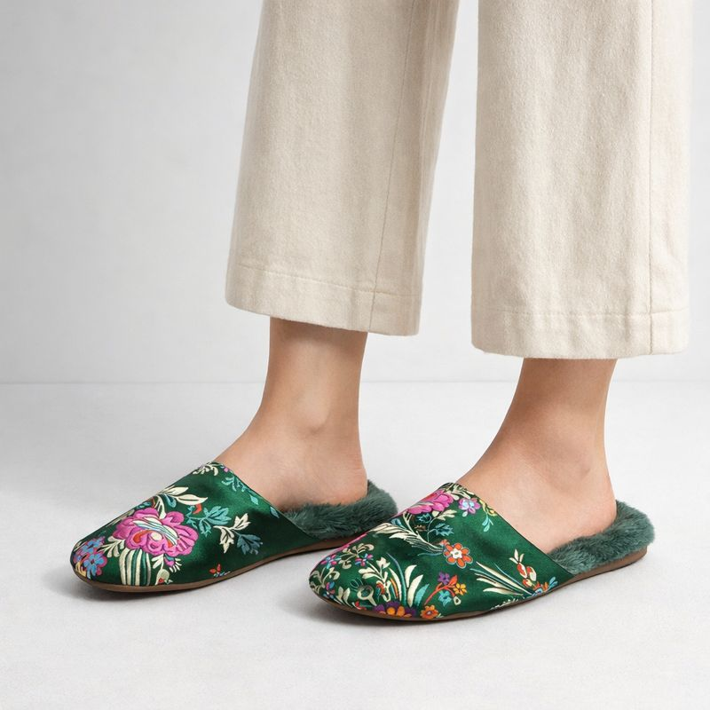 Satin floral slippers with embroidered detailing and soft plush lining, shown in green, pink and black