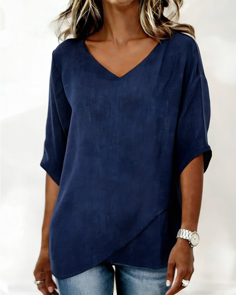 Donna irregular V-neck top shown in blue, white and navy blue
