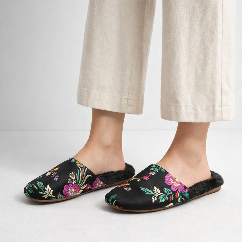 Satin floral slippers with embroidered detailing and soft plush lining, shown in green, pink and black