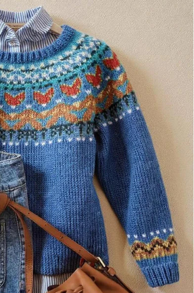 Blue vintage-inspired Nordic knit jumper with a relaxed drape and ribbed cuffs