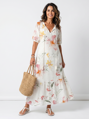 Noa white floral tiered midi dress with tassel details and a relaxed silhouette