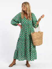 Fiora dark green floral print v-neck tiered midi dress with a relaxed fit