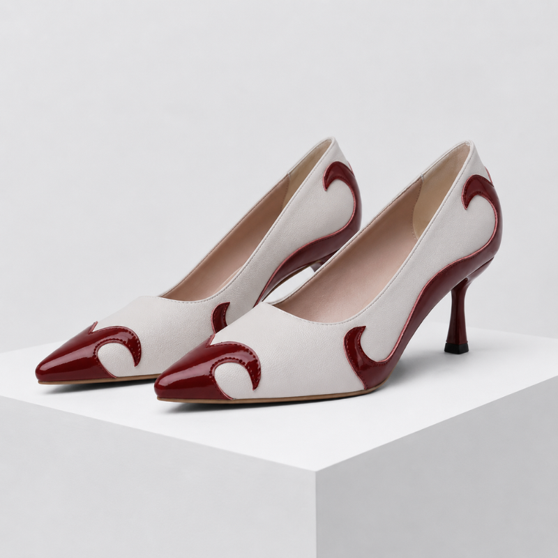 Pointed-toe pumps with flame-inspired contrast pattern and low flared heel in black and red
