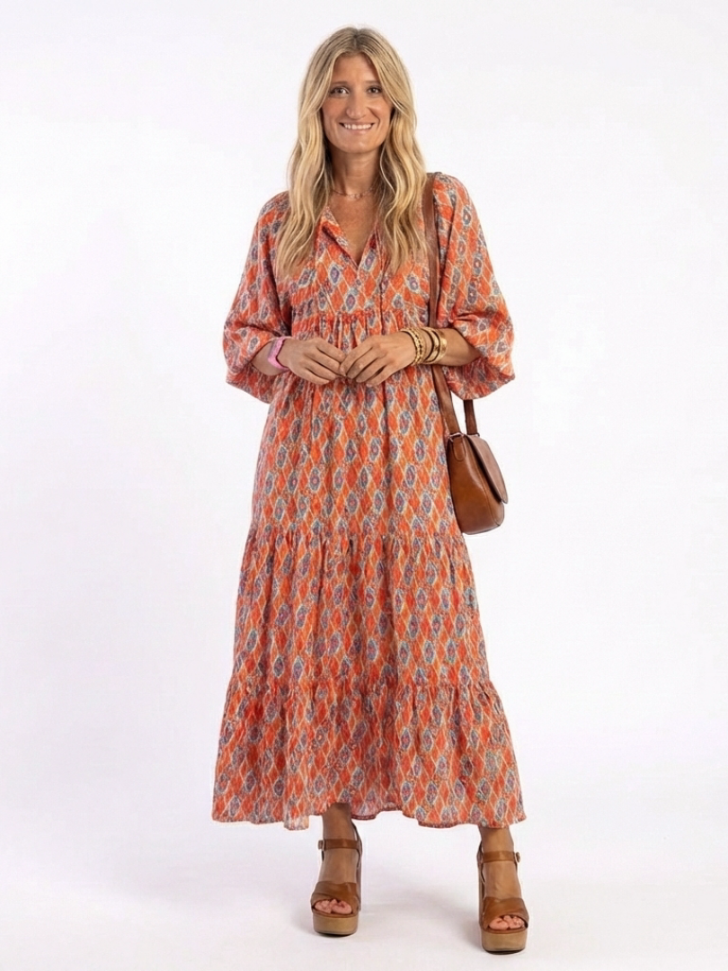 Beige geometric print v-neck tiered midi dress with relaxed silhouette and pockets