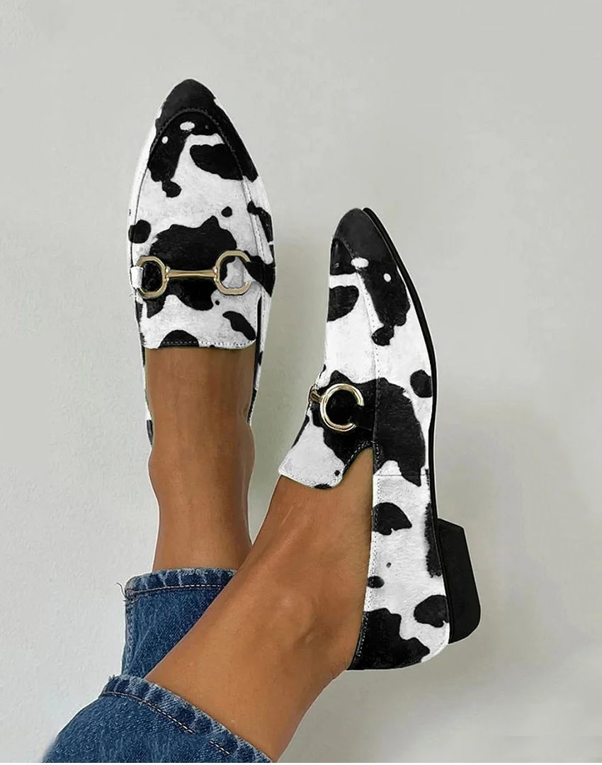Black printed loafers with buckle detail, classic slip-on silhouette