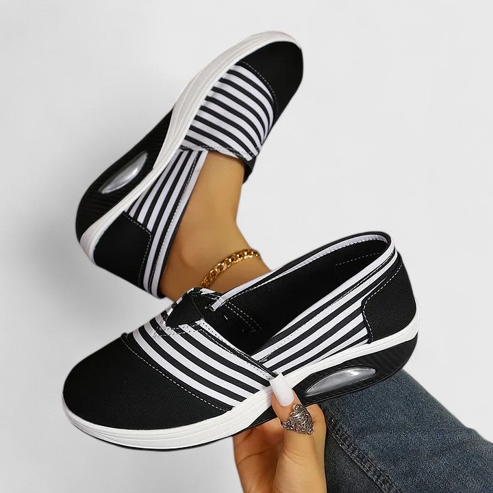 Comfortable everyday women's slip-on sneakers shown in blue, black and red