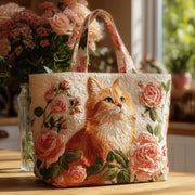 Artisanal handmade tote bag featuring an orange cat and roses design