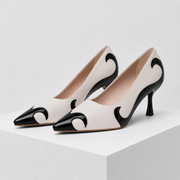 Pointed-toe pumps with flame-inspired contrast pattern and low flared heel in black and red