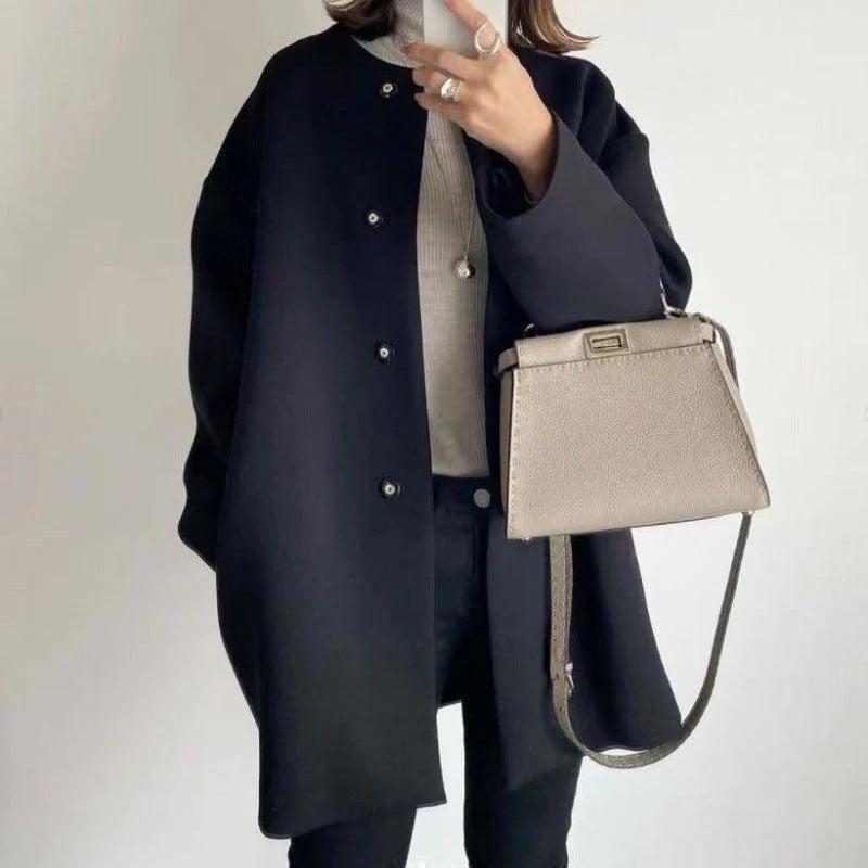 Orla relaxed fit coat shown in a neutral shade, styled for everyday wear