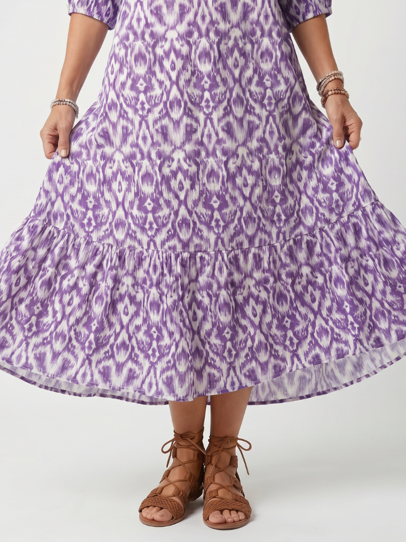 Purple printed tassel tie midi dress with a relaxed silhouette and pockets