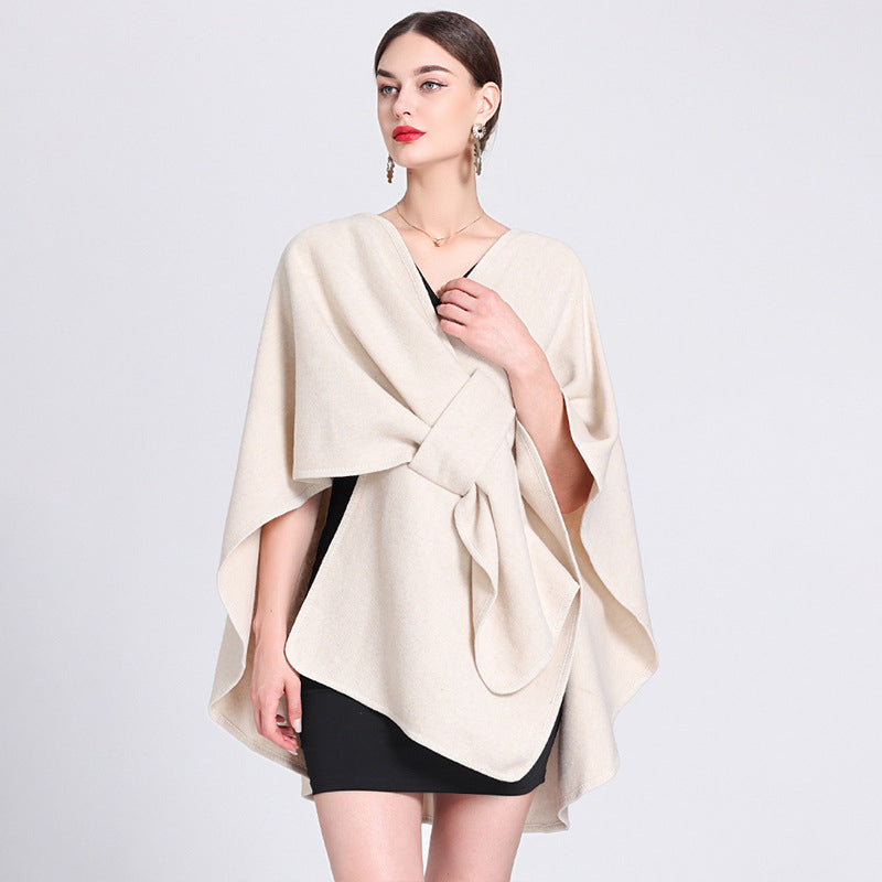 Marina caped fleece shawl draped over the shoulders in a soft neutral tone