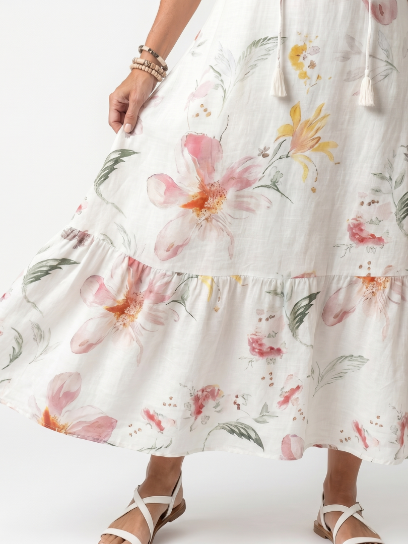 Noa white floral tiered midi dress with tassel details and a relaxed silhouette