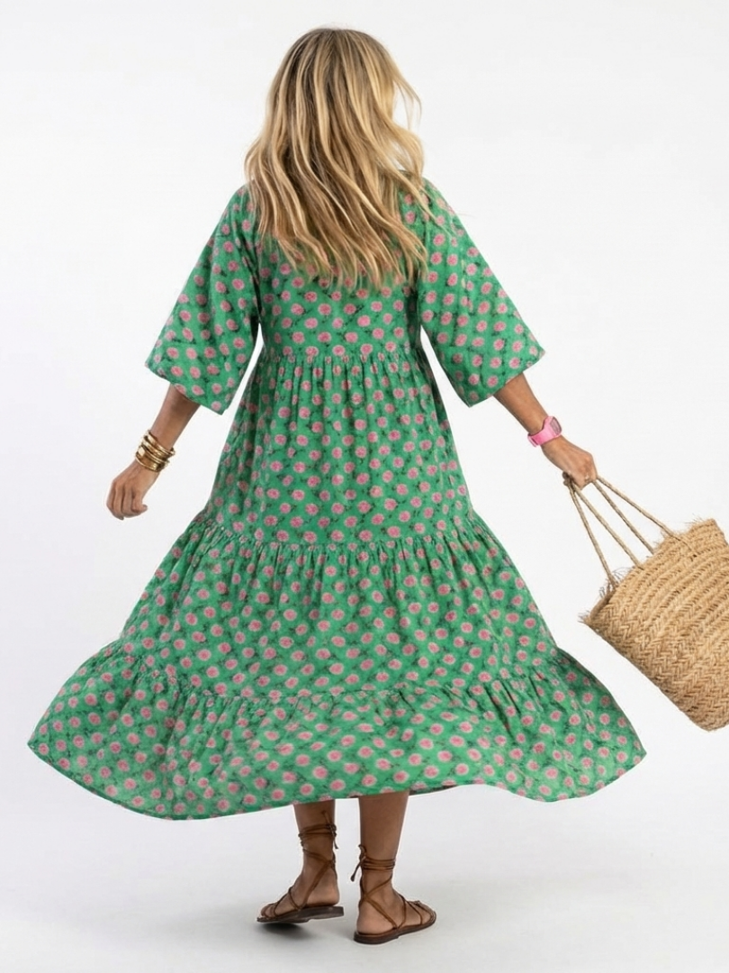 Fiora dark green floral print v-neck tiered midi dress with a relaxed fit