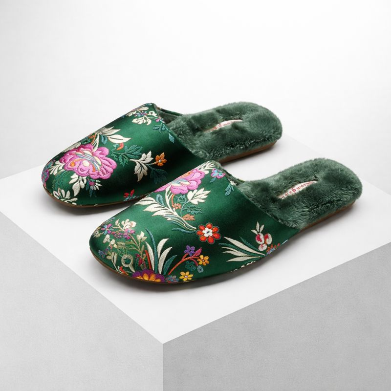 Satin floral slippers with embroidered detailing and soft plush lining, shown in green, pink and black