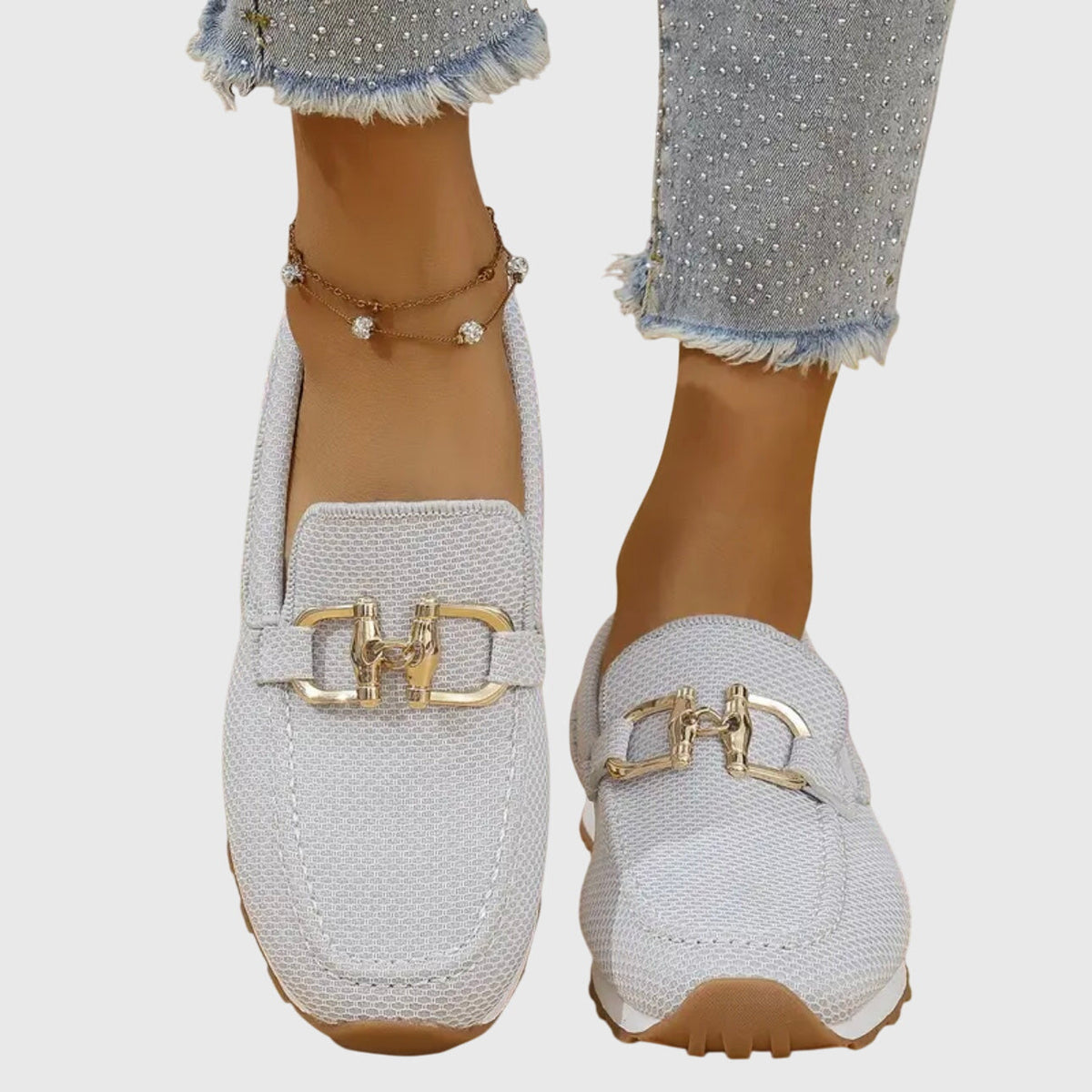 Womens slip-on loafers in neutral tones with a clean, casual silhouette