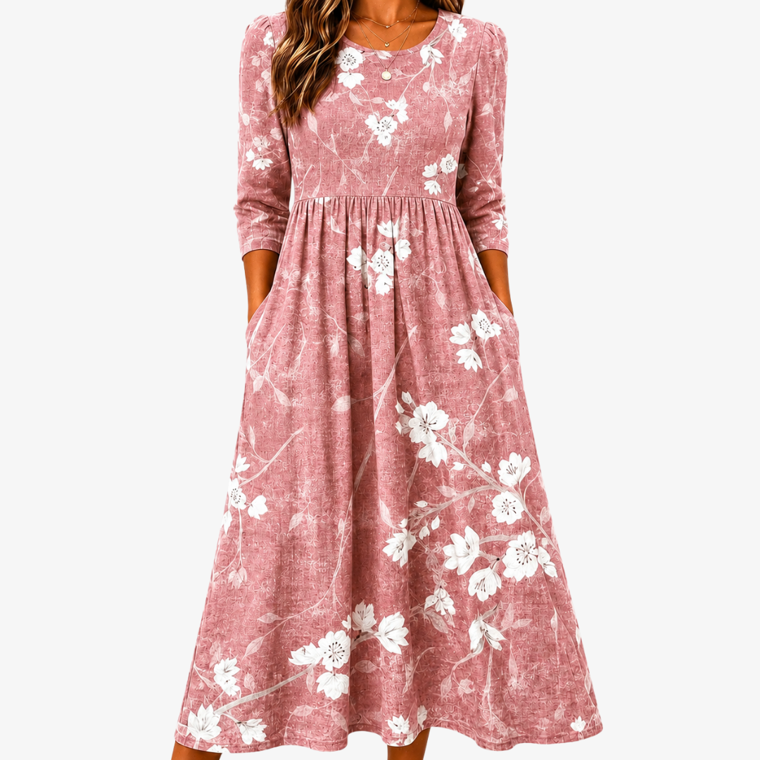 Bree blush floral summer dress with a lightweight flowing silhouette and pockets