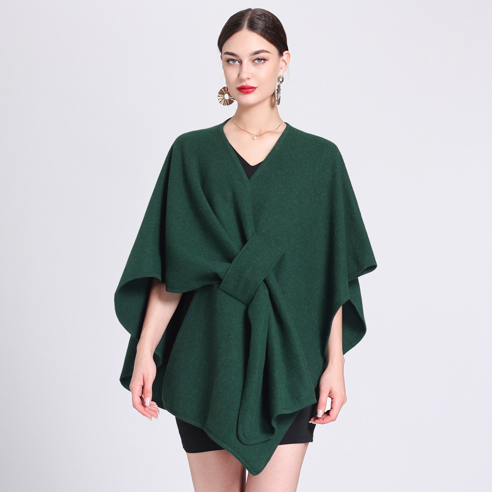 Marina caped fleece shawl draped over the shoulders in a soft neutral tone