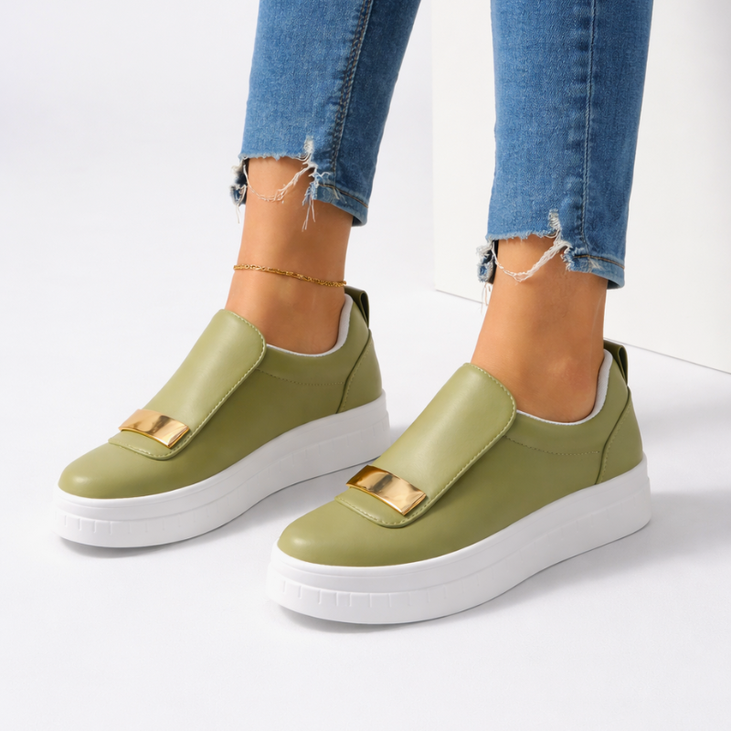 Cushioned platform slip-on shoes shown in green, white and black