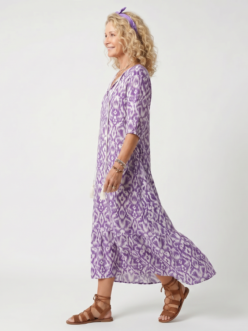 Purple printed tassel tie midi dress with a relaxed silhouette and pockets