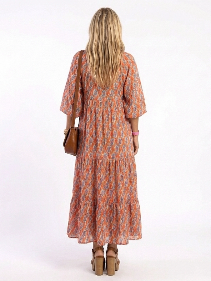 Beige geometric print v-neck tiered midi dress with relaxed silhouette and pockets