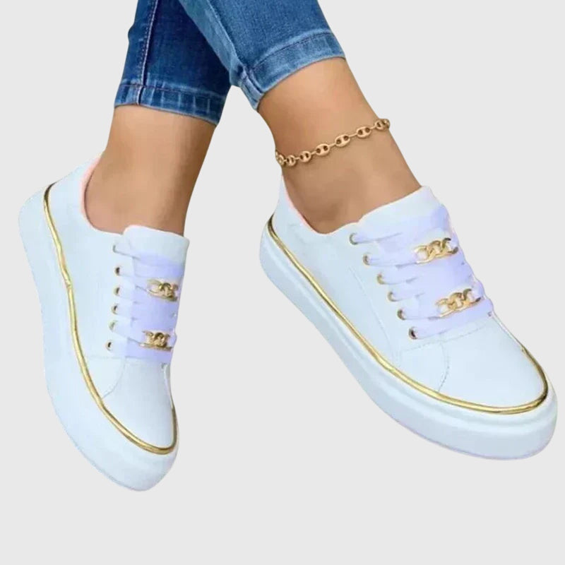 Camille slip-on everyday sneakers shown in black, white and gold