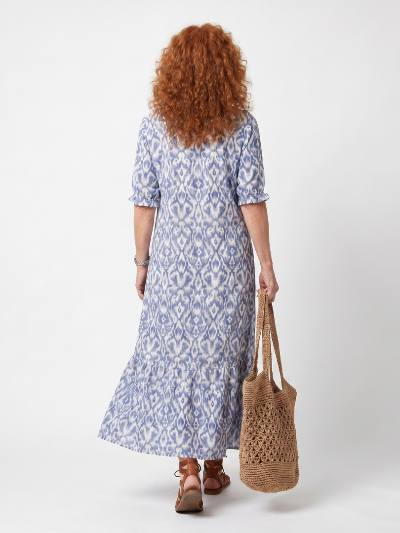 Ottoline blue printed midi dress with tassel tie neckline and relaxed silhouette