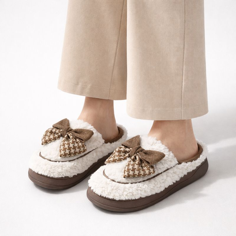 Soft teddy slippers with an oversized bow detail and non-slip sole in brown and white