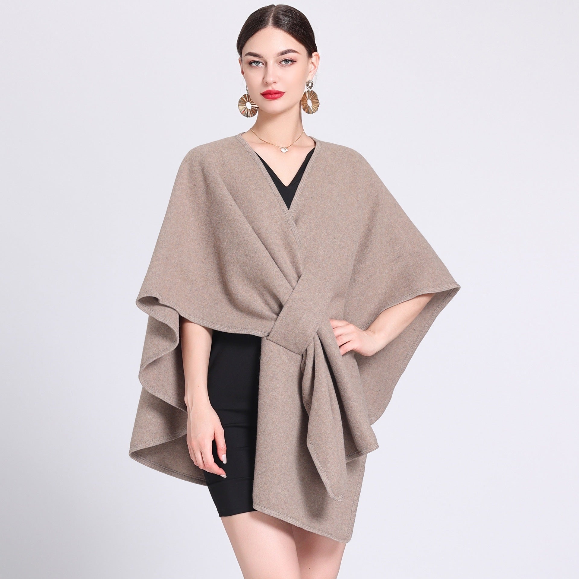 Marina caped fleece shawl draped over the shoulders in a soft neutral tone