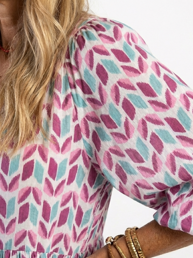 Mireya rose gold geometric print long sleeve tiered midi dress with relaxed silhouette