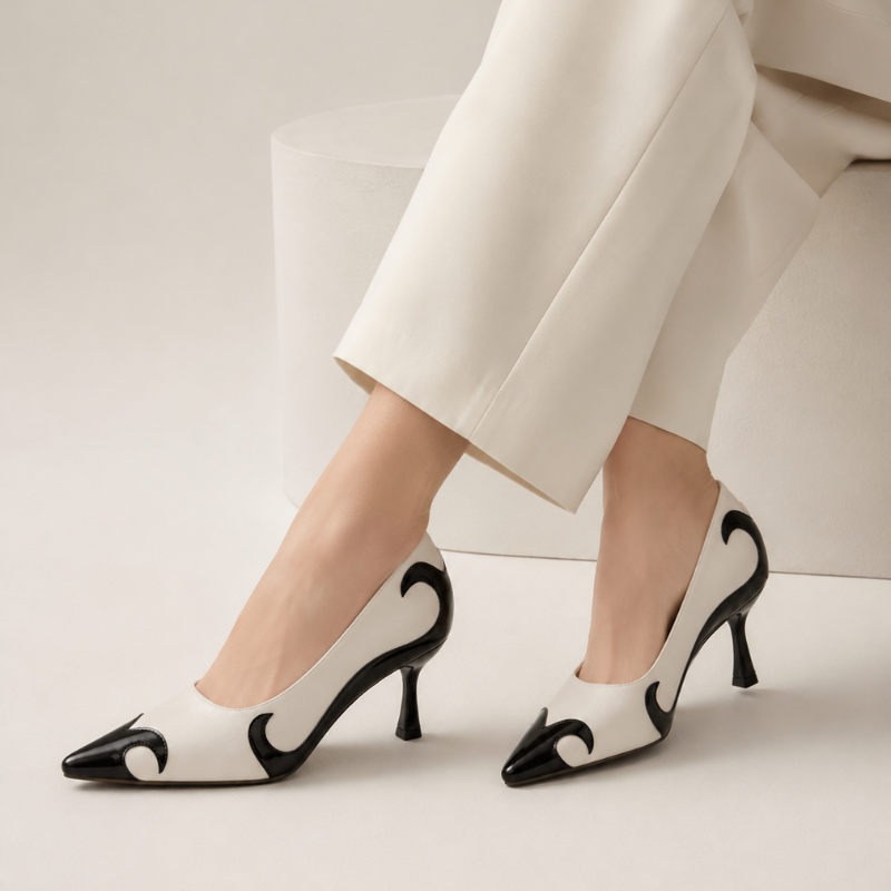 Pointed-toe pumps with flame-inspired contrast pattern and low flared heel in black and red