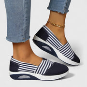 Comfortable everyday women's slip-on sneakers shown in blue, black and red