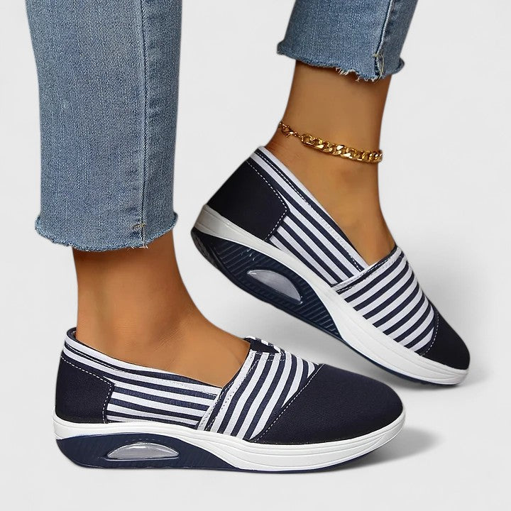 Comfortable everyday women's slip-on sneakers shown in blue, black and red