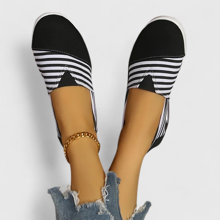 Comfortable everyday women's slip-on sneakers shown in blue, black and red
