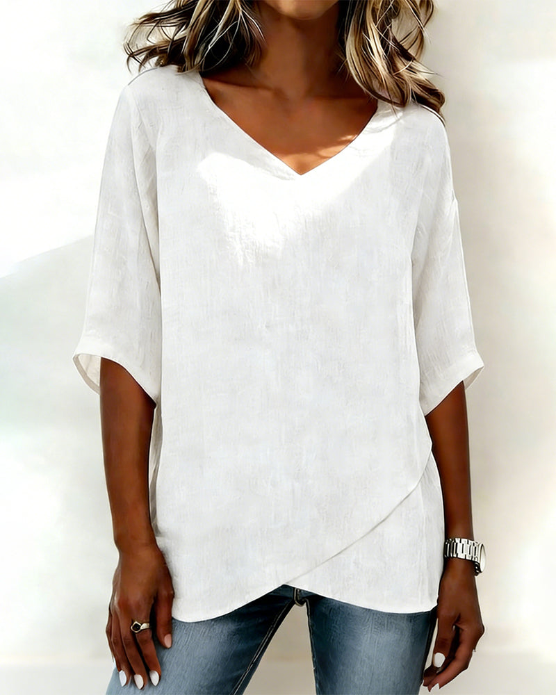 Donna irregular V-neck top shown in blue, white and navy blue