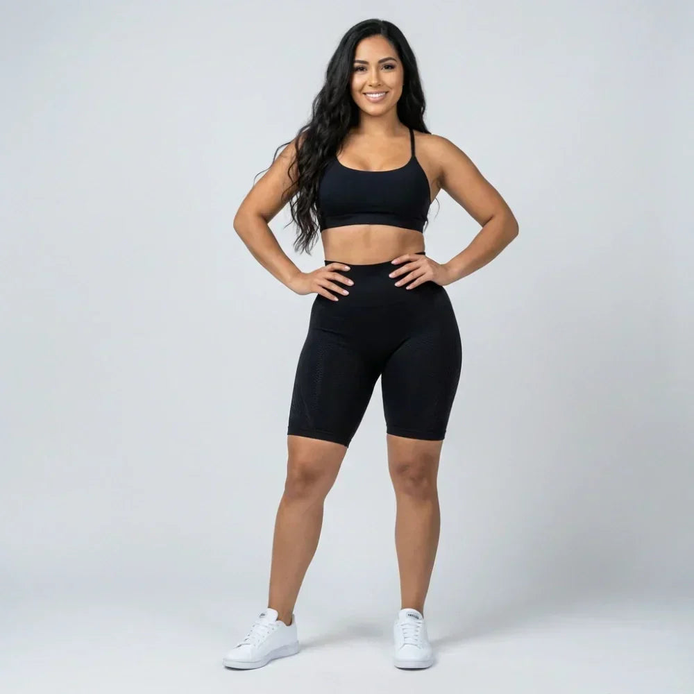 Black short sculpting legging with a flattering short cut for workouts and everyday wear