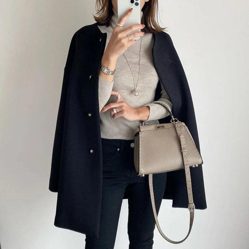 Orla relaxed fit coat shown in a neutral shade, styled for everyday wear