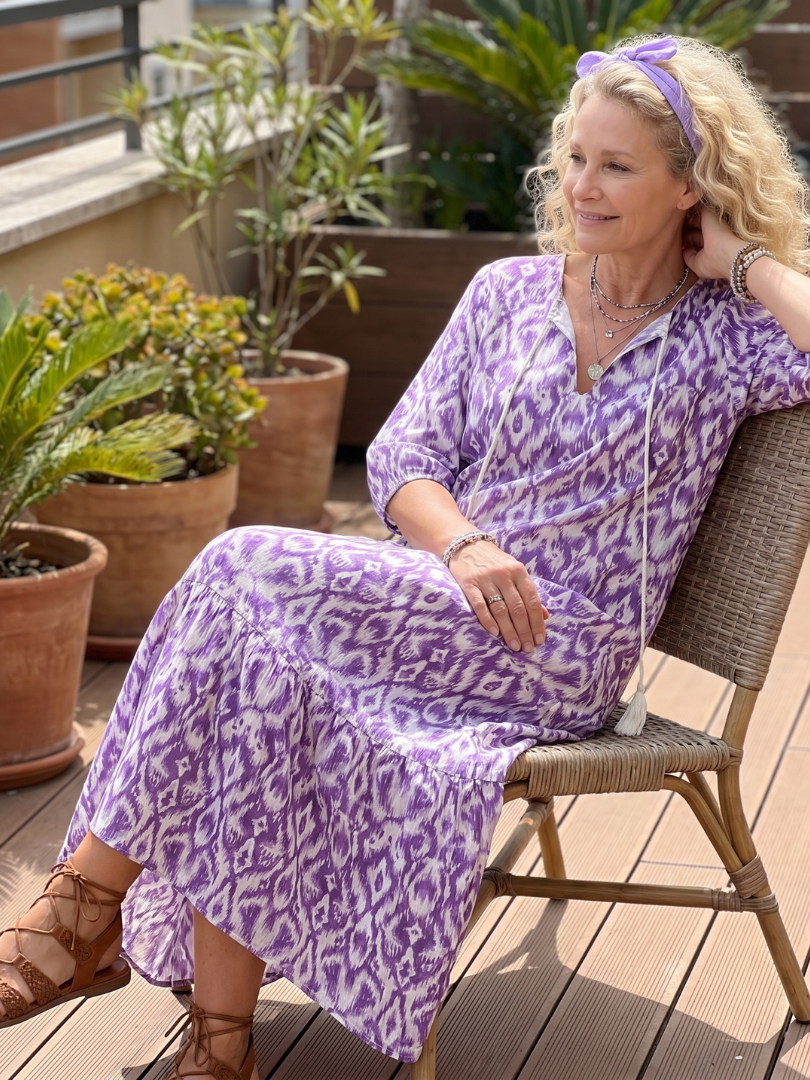 Purple printed tassel tie midi dress with a relaxed silhouette and pockets