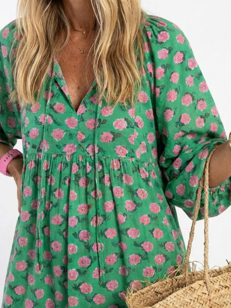 Fiora dark green floral print v-neck tiered midi dress with a relaxed fit