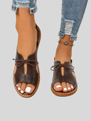 Elegant lace-up sandals with a cushioned sole, styled for everyday wear