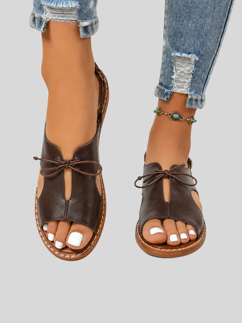 Elegant lace-up sandals with a cushioned sole, styled for everyday wear