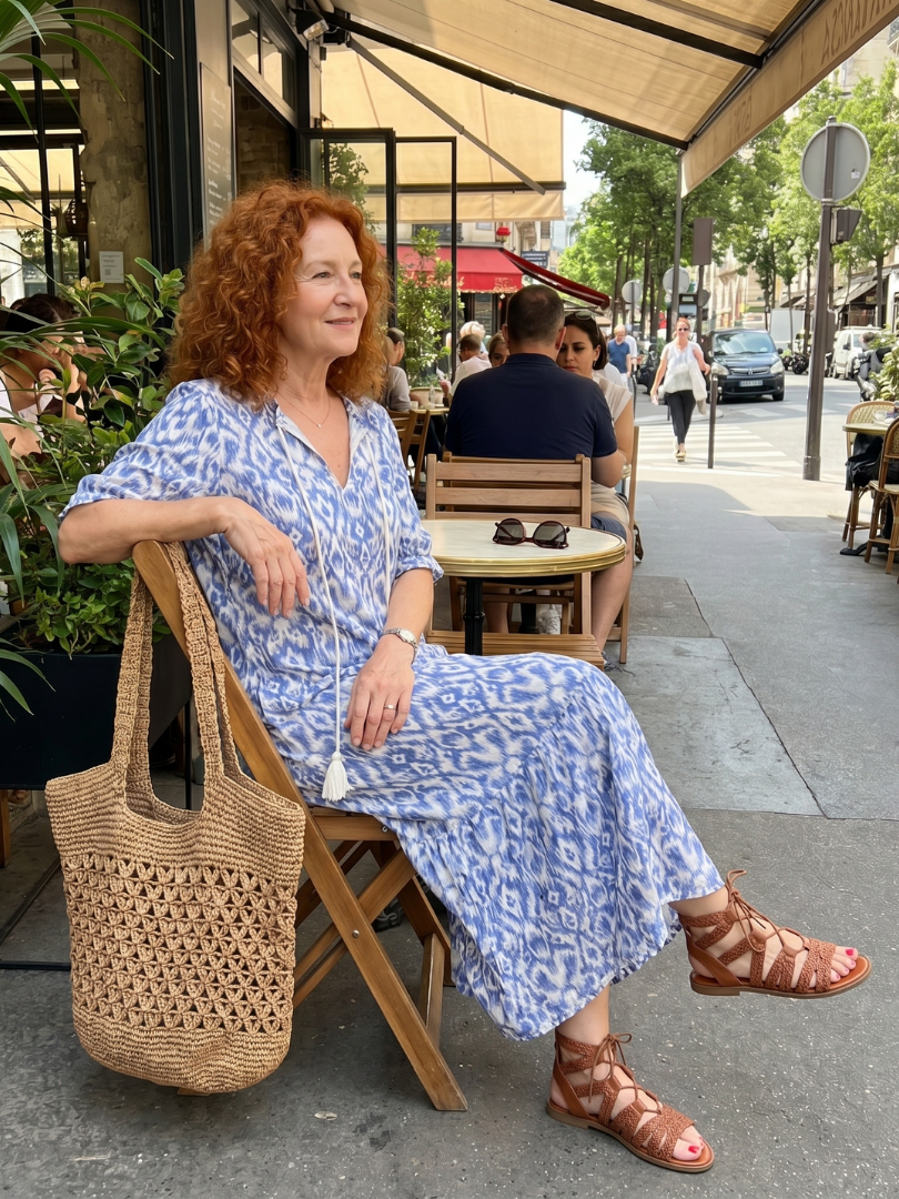 Ottoline blue printed midi dress with tassel tie neckline and relaxed silhouette