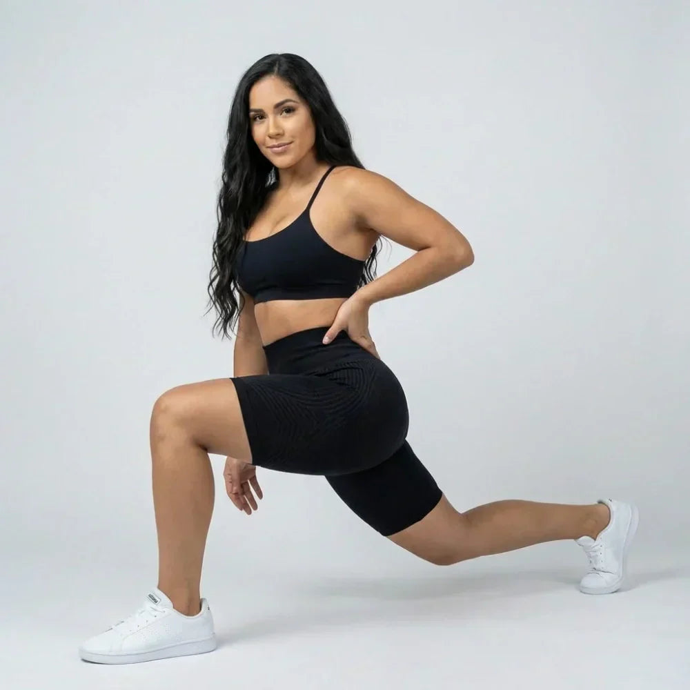 Black short sculpting legging with a flattering short cut for workouts and everyday wear