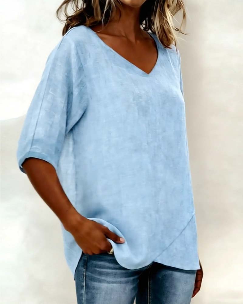 Donna irregular V-neck top shown in blue, white and navy blue