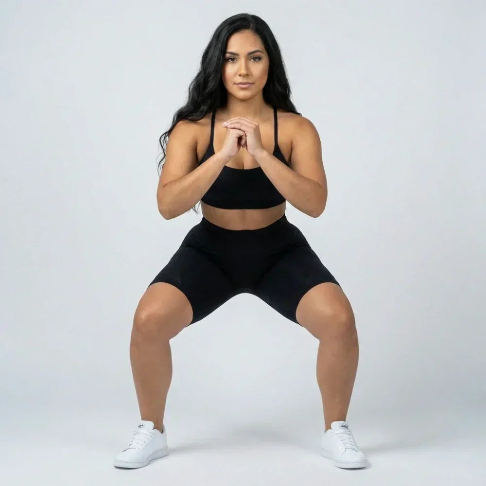Black short sculpting legging with a flattering short cut for workouts and everyday wear