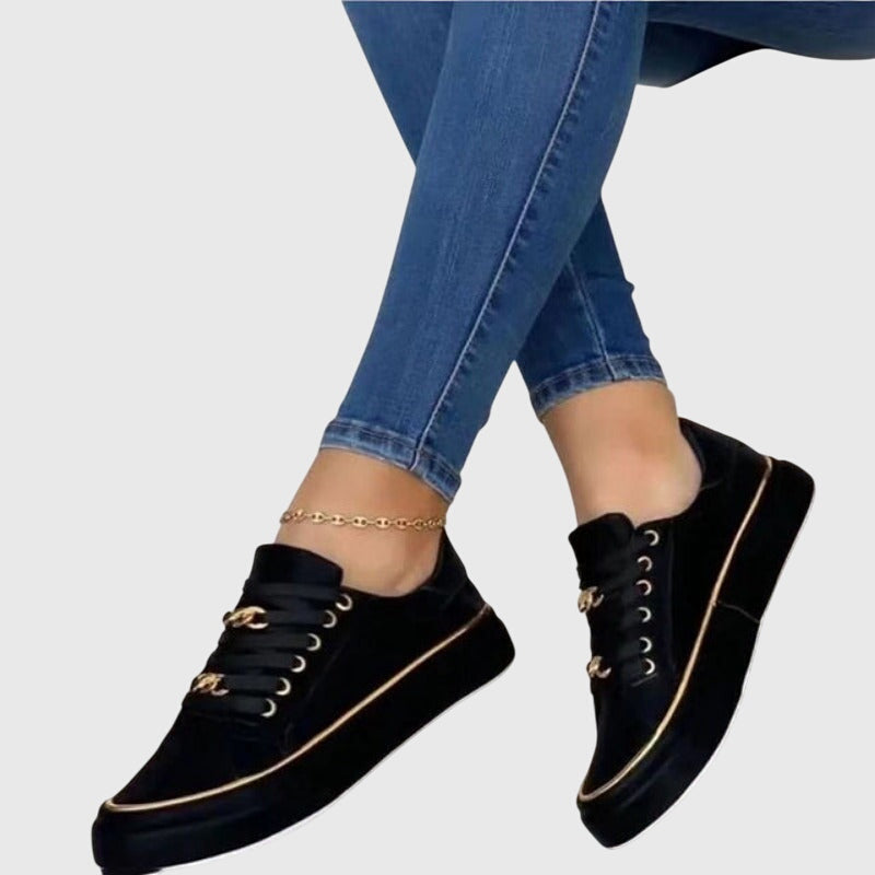 Camille slip-on everyday sneakers shown in black, white and gold