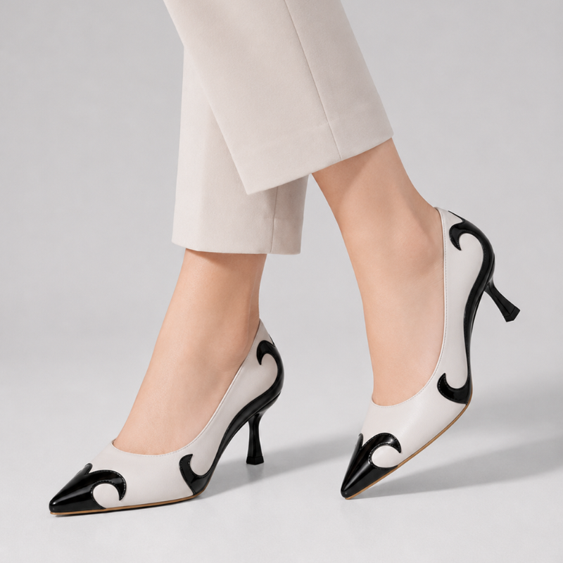 Pointed-toe pumps with flame-inspired contrast pattern and low flared heel in black and red
