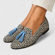 Black and white refined loafers with a classic slip-on silhouette