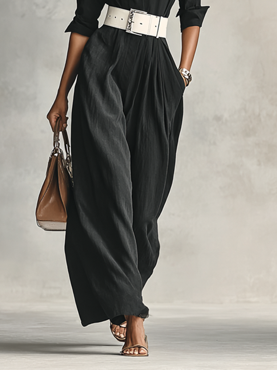 Black longline single-breasted jacket with a classic lapel, worn open